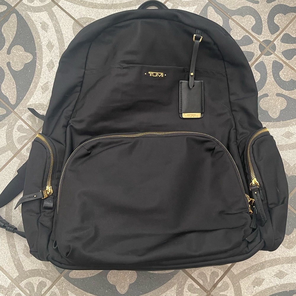 Tumi Black Backpack with Gold Accents